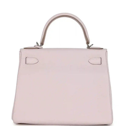 Light mauve leather handbag front view with top handle and symmetrical side seams