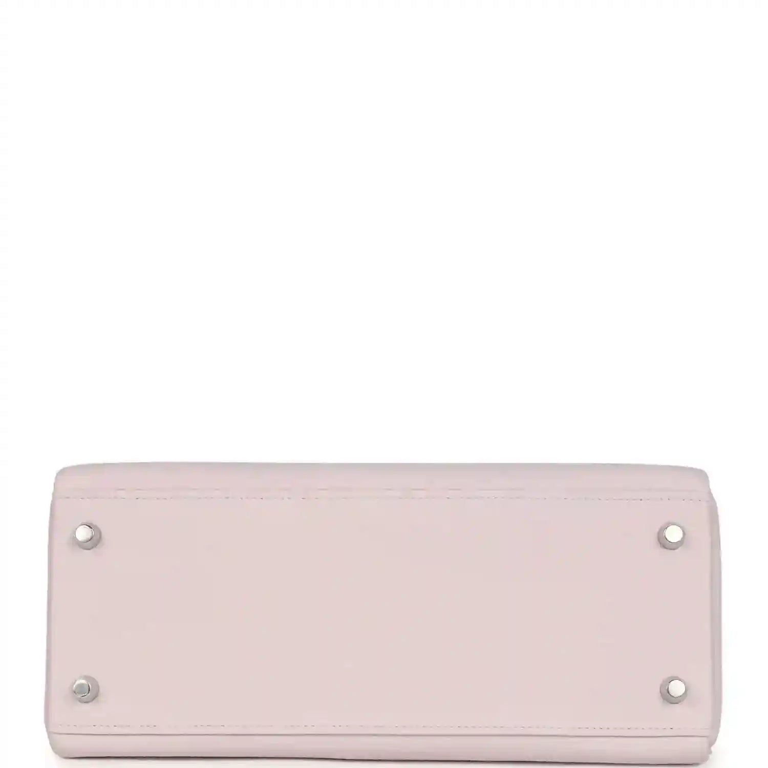 Light mauve leather handbag with silver snap buttons on back panel