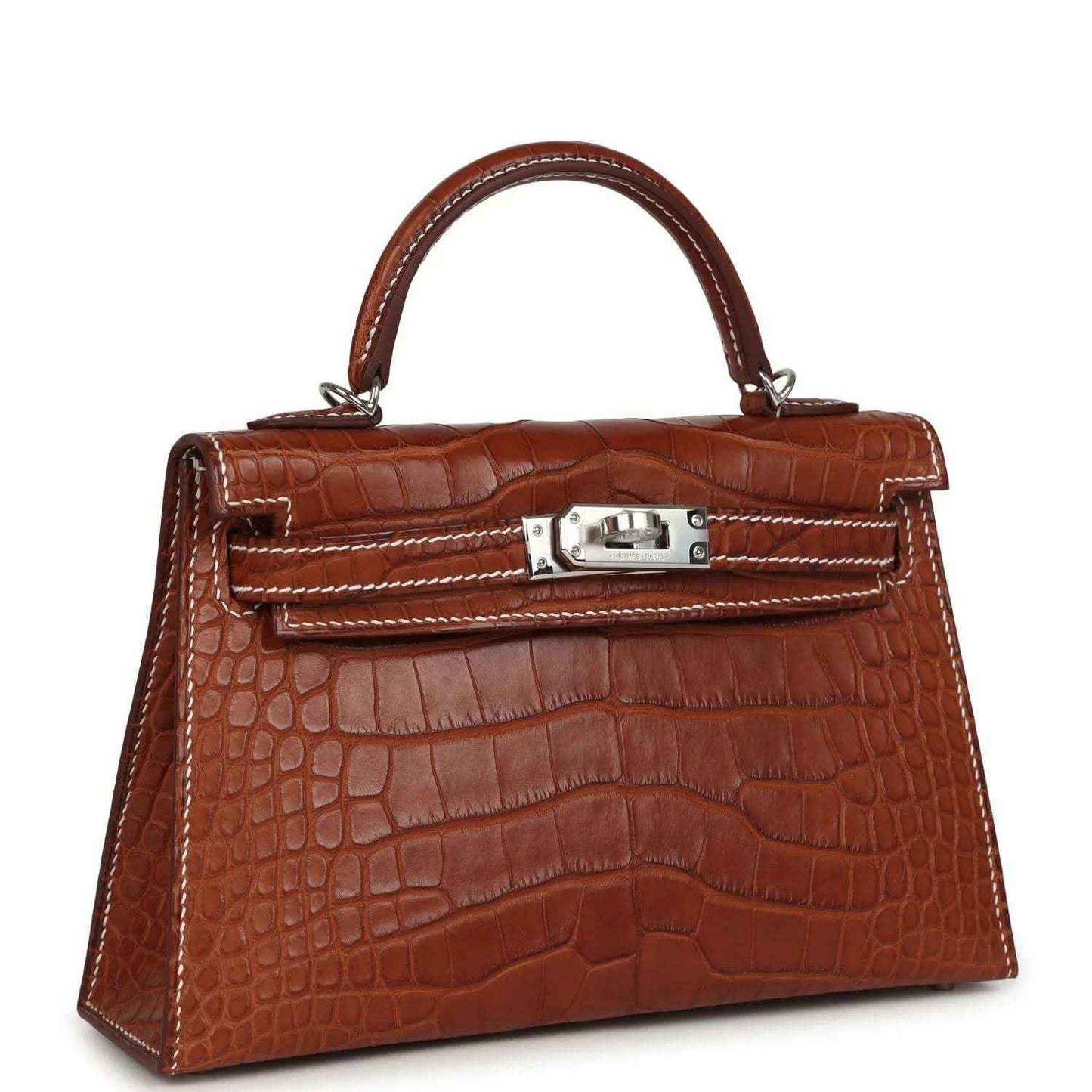 Crocodile leather Kelly Sellier bag with top handle, front lock, and stitched trim