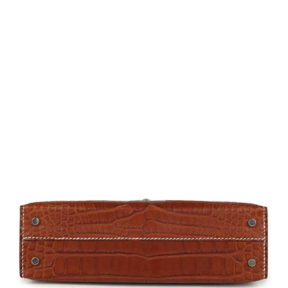 Croc leather bag base with stitched edge and four metal corner feet