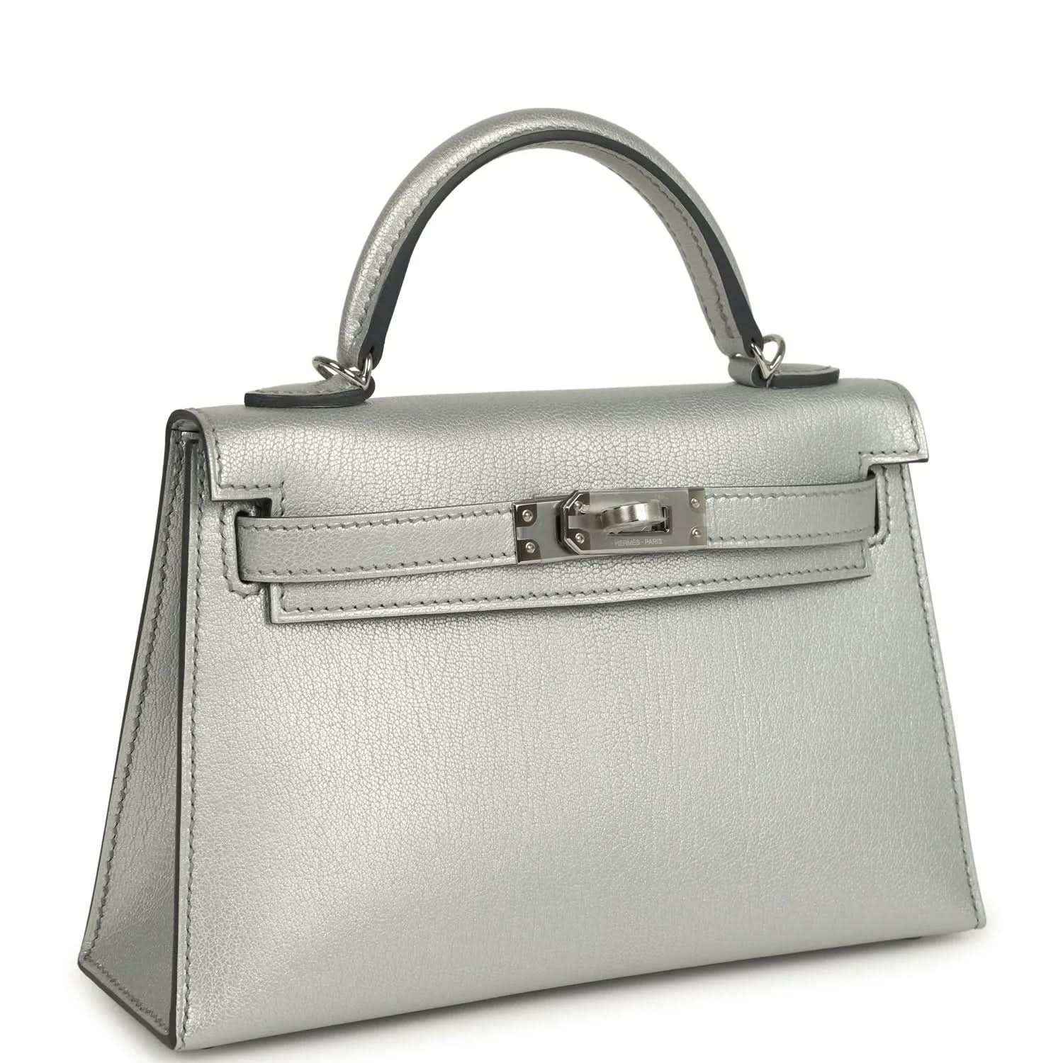 Light gray leather mini handbag with top handle and front turn-lock clasp