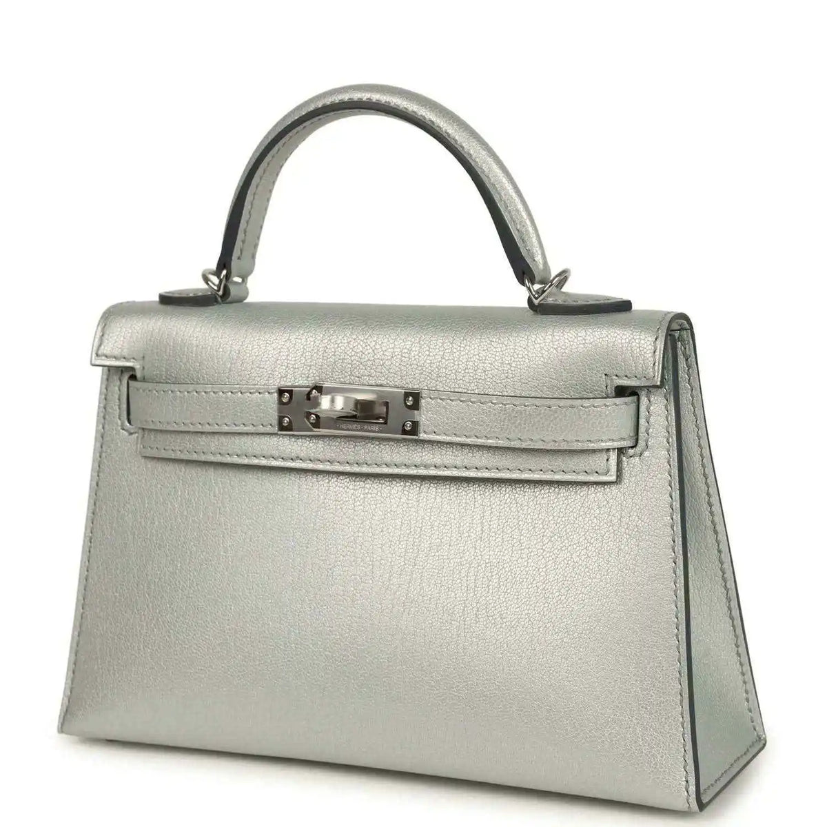 Light gray leather mini handbag with top handle, front turn-lock and side panels