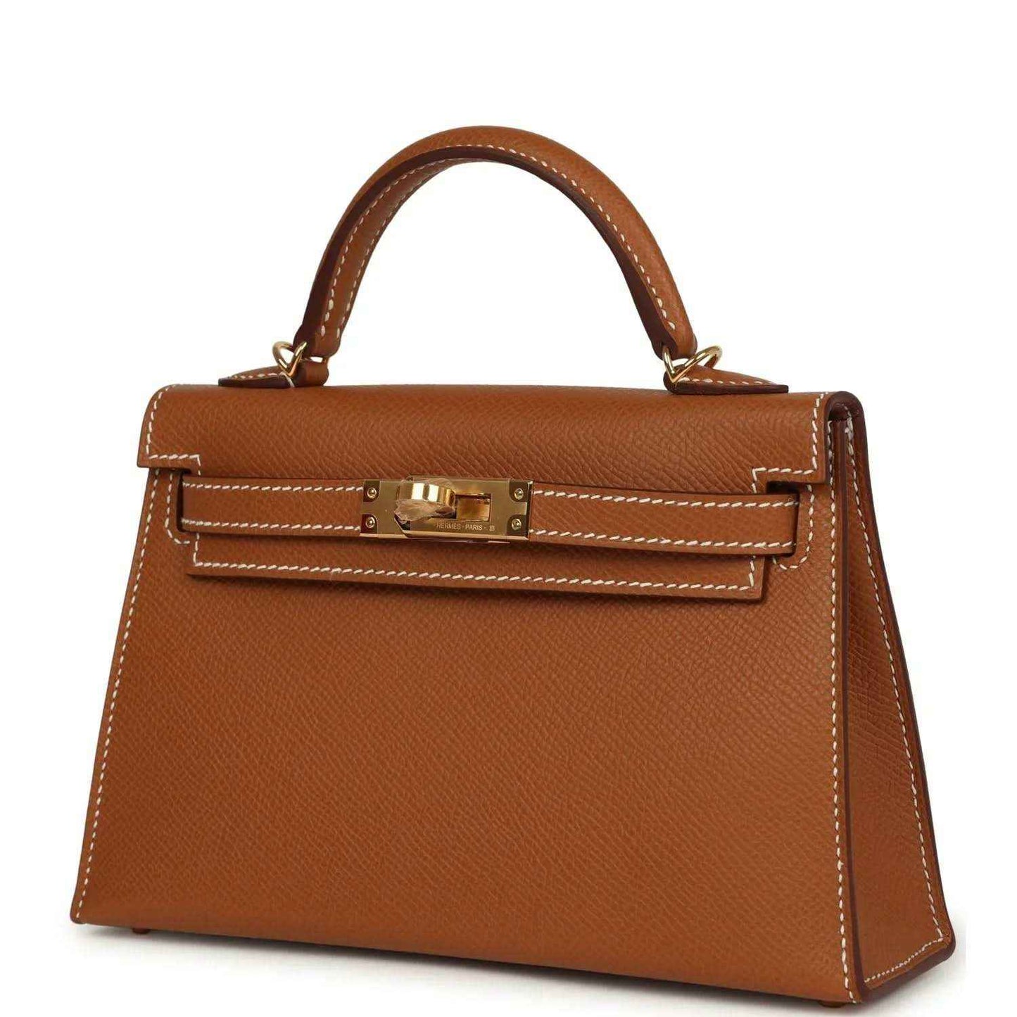 Tan textured leather mini handbag with gold front clasp and structured corners