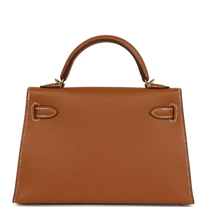 Tan textured leather mini handbag with top handles and gold front turn-lock