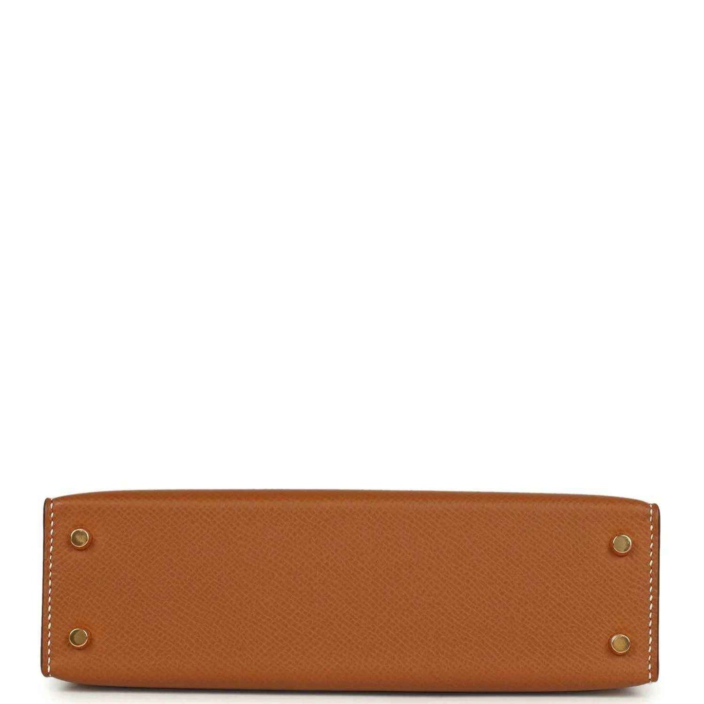 Tan textured mini handbag with four gold hardware studs at the base