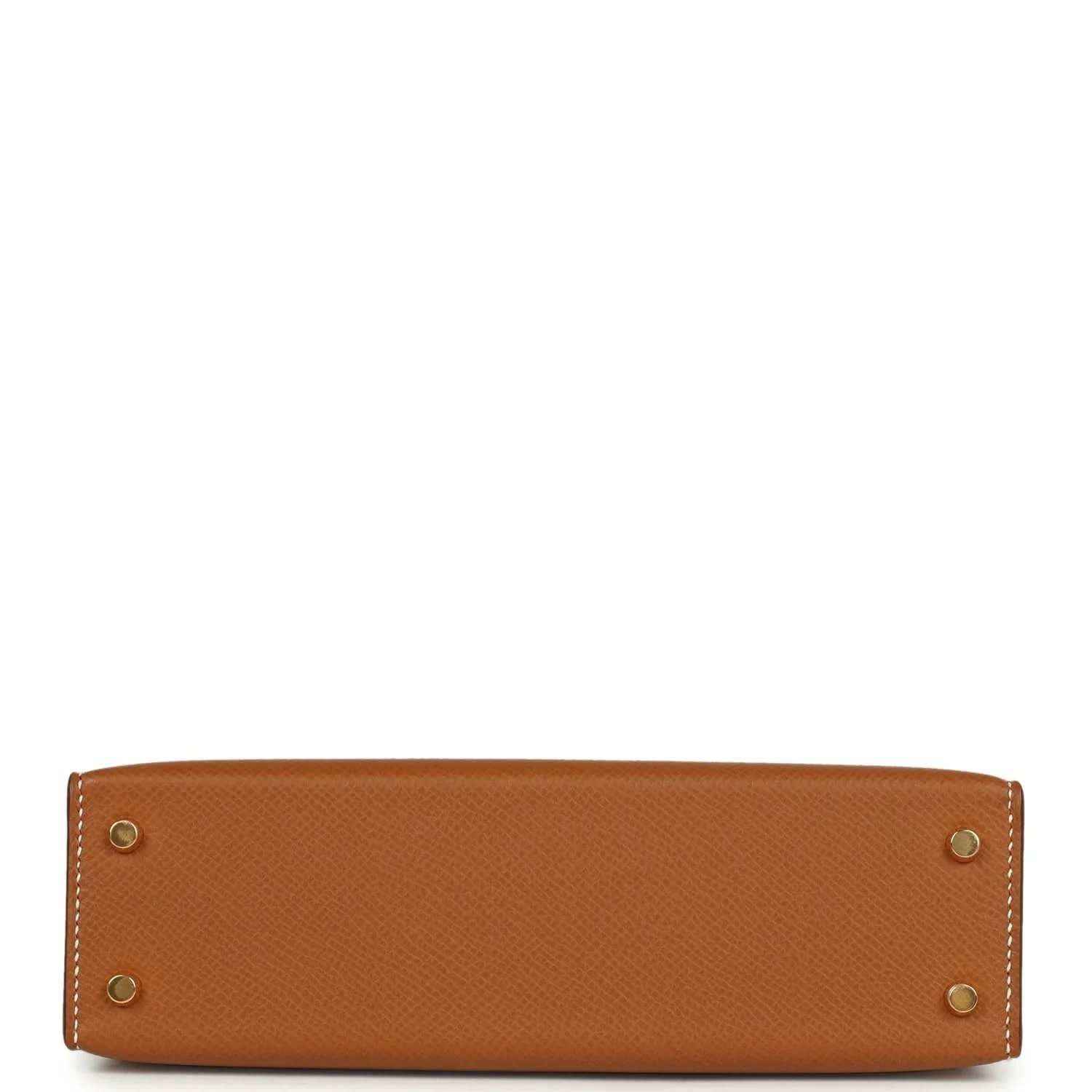 Tan textured mini handbag with four gold hardware studs at the base