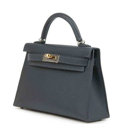 Hermes Kelly Sellier 20 bag side angle, dark gray-blue leather, top handle, gold-tone clasp