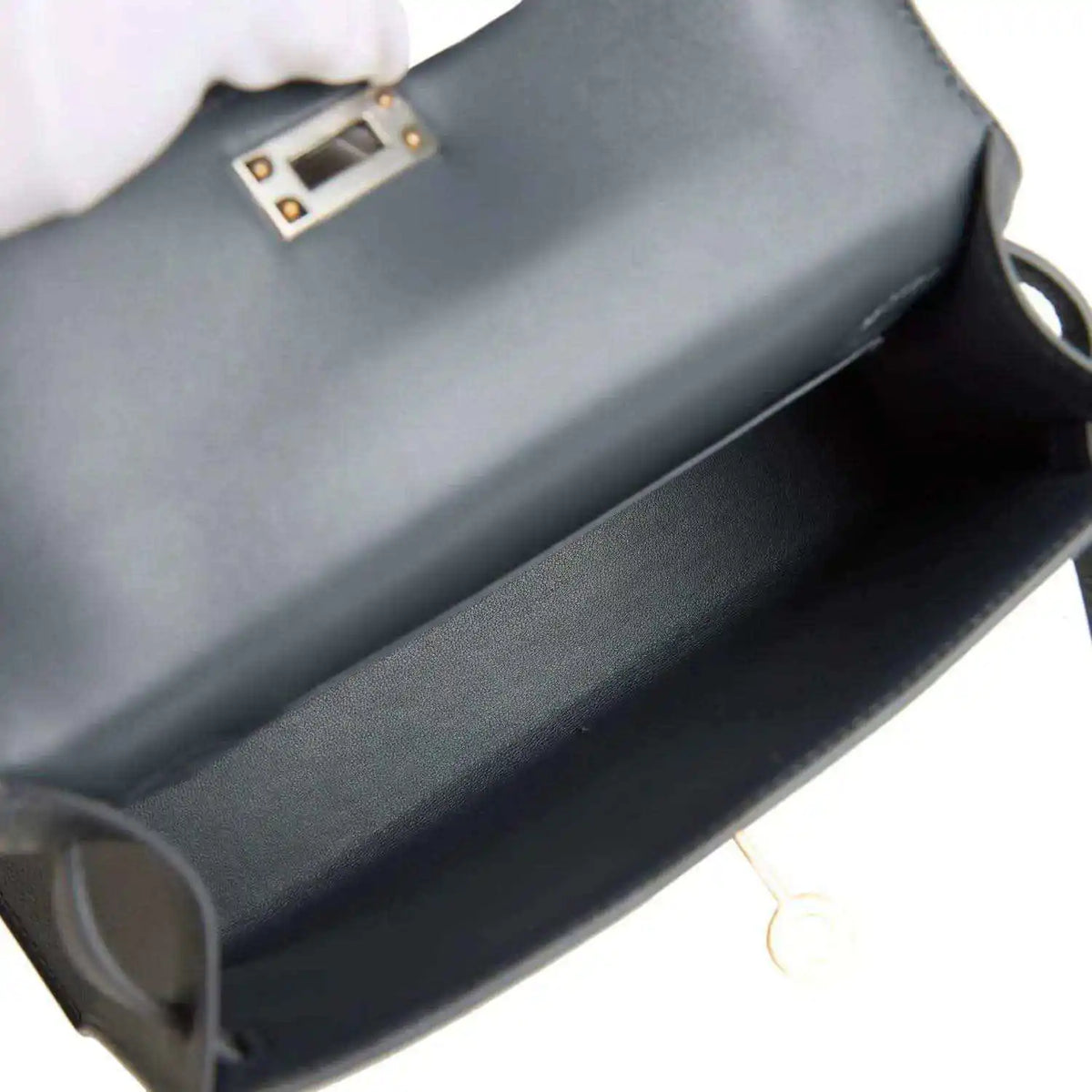 Hermes Kelly Sellier 20 bag interior view with dark gray-blue lining and clasp edge