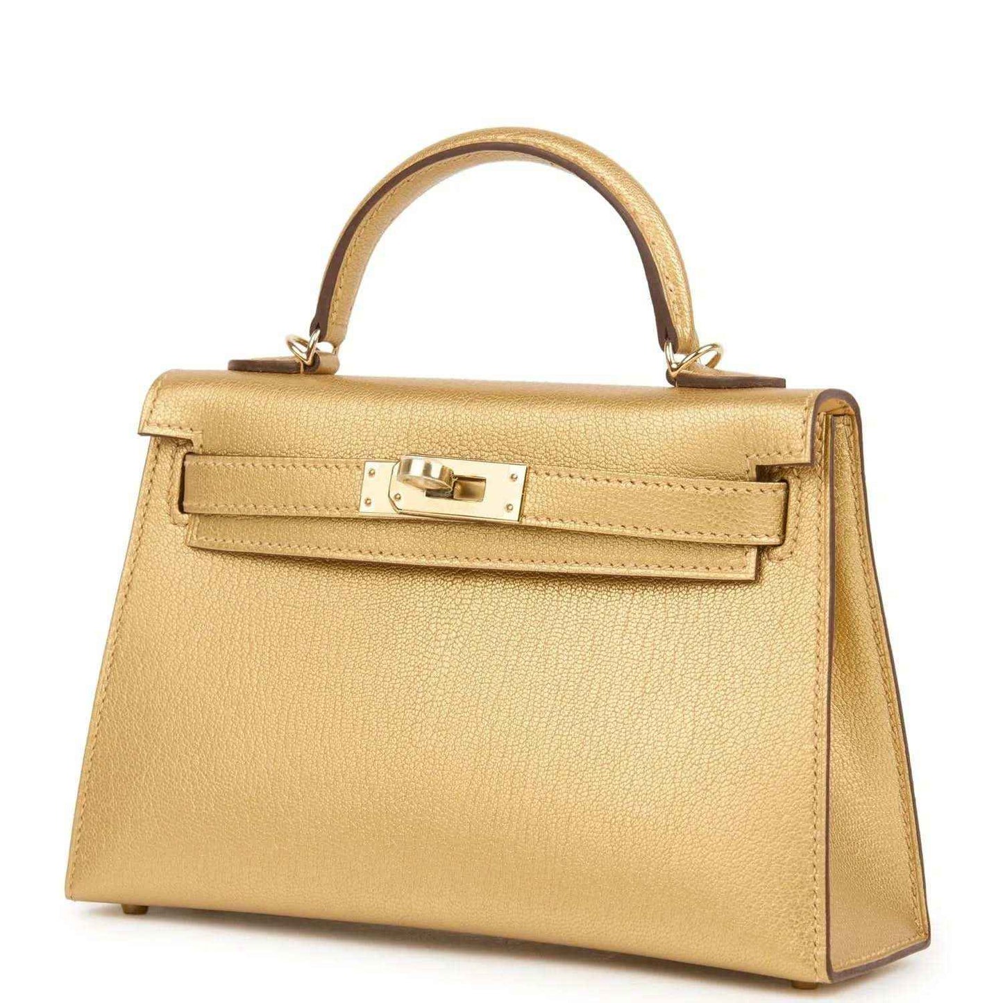 Kelly Sellier 20 handbag in gold leather, angled front view with lock hardware