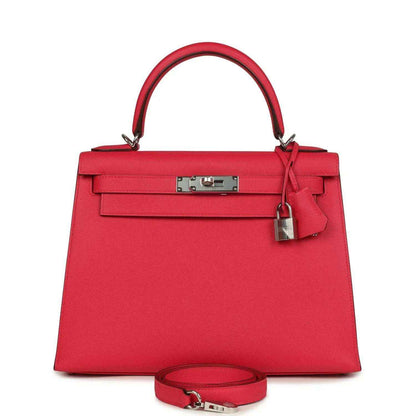 Red leather handbag with top handle, front flap, and palladium-toned hardware.