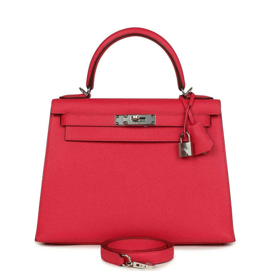 Red leather handbag with top handle, front flap, and palladium-toned hardware.