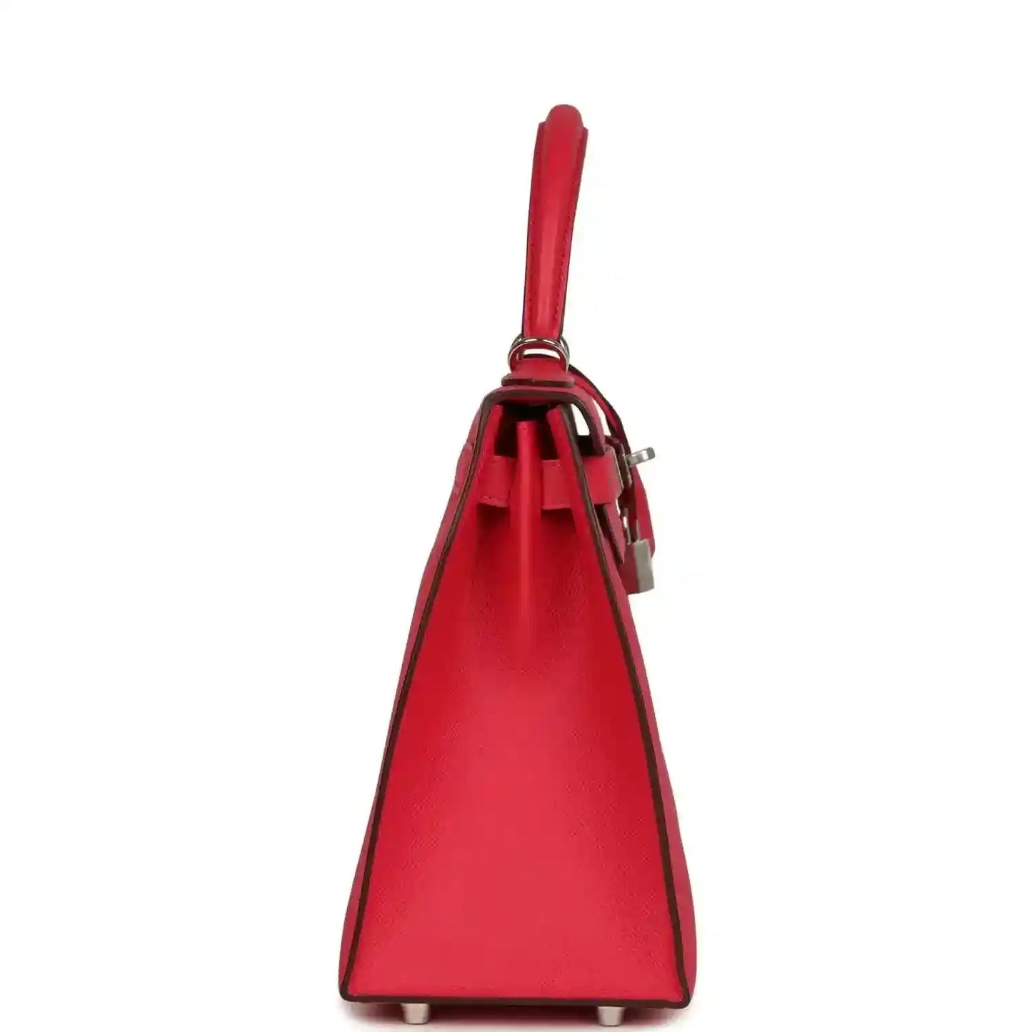 Red leather handbag with single top handle and hanging padlock and strap details.