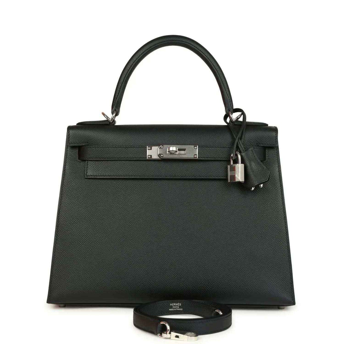 Small structured leather handbag with top handles, front flap, and metal clasp plus lock