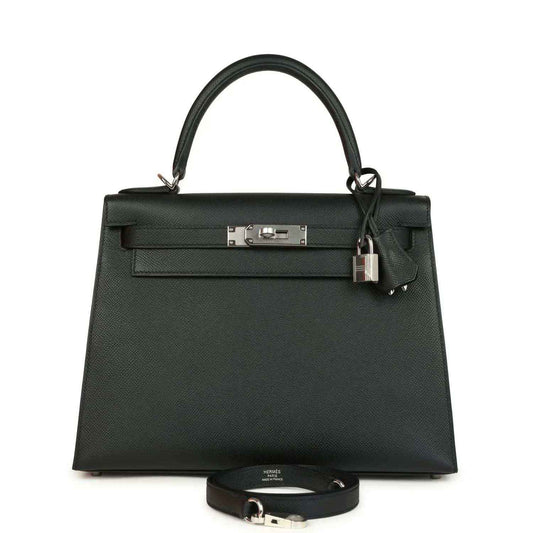 Small structured leather handbag with top handles, front flap, and metal clasp plus lock