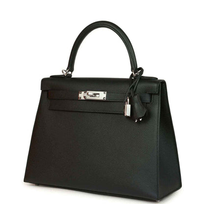 Structured leather handbag with front flap, metal clasp, top handles, and lock detail