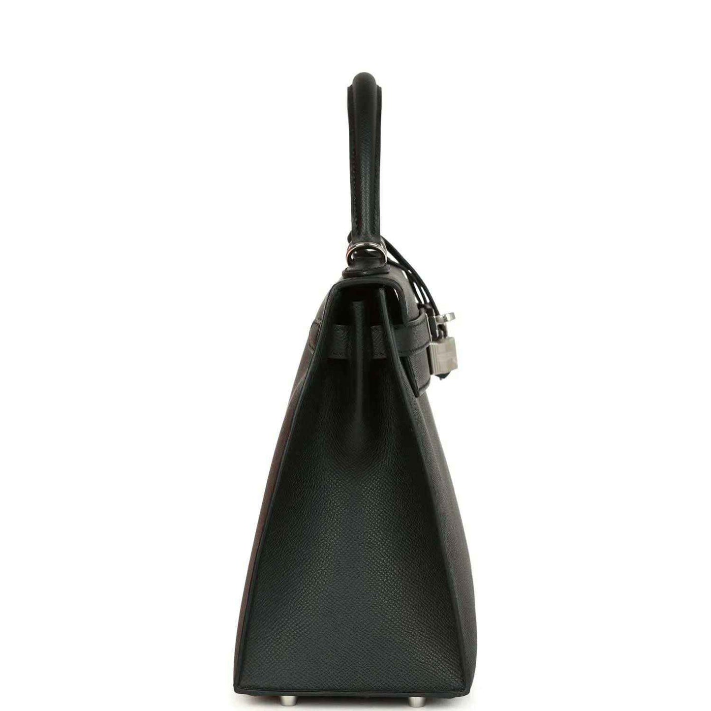 Structured leather handbag side view with top handle and metal lock hardware