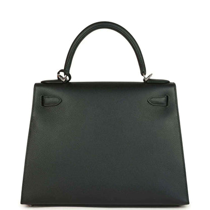 Structured leather handbag with top handles and front flap with hardware accents