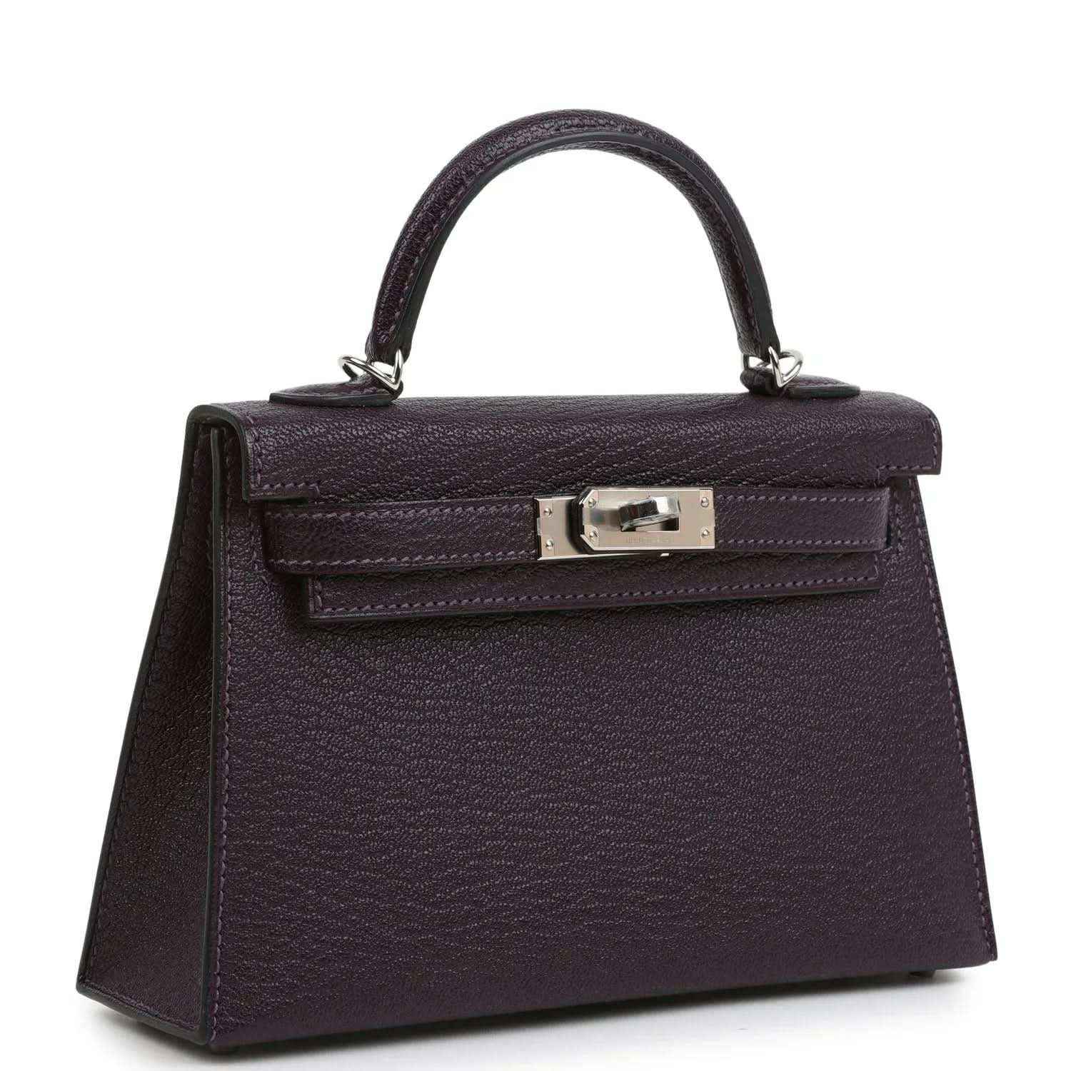 Purple leather handbag with top handle and front flap, metal clasp hardware.