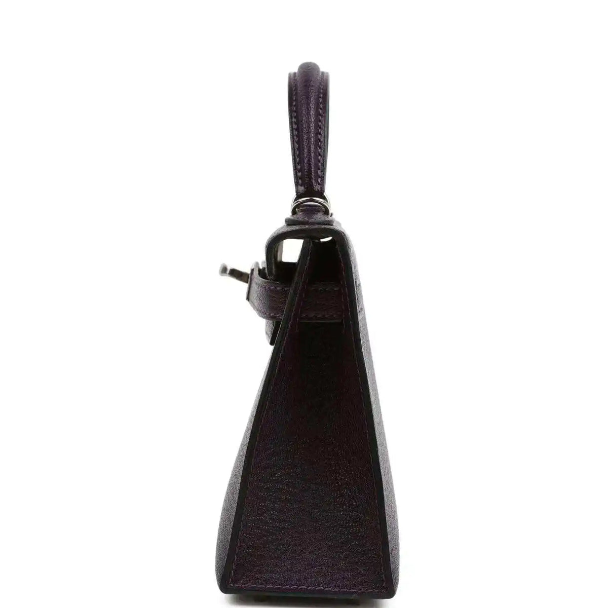 Purple leather handbag with top handle, side profile and leather strap attachment.