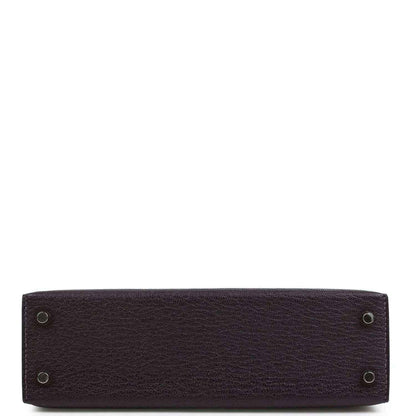 Purple leather handbag base with four metal feet and pebbled texture.