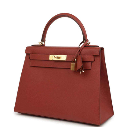 Red Kelly handbag front view with gold lock hardware and top handle strap