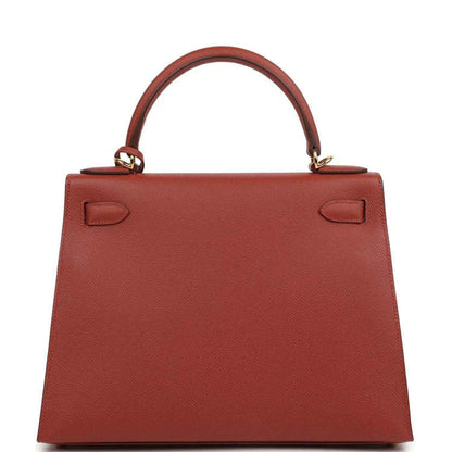 Red Kelly handbag back panel with top handle and leather strap loops