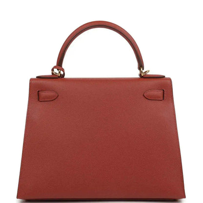 Red Kelly handbag back panel with top handle and leather strap loops