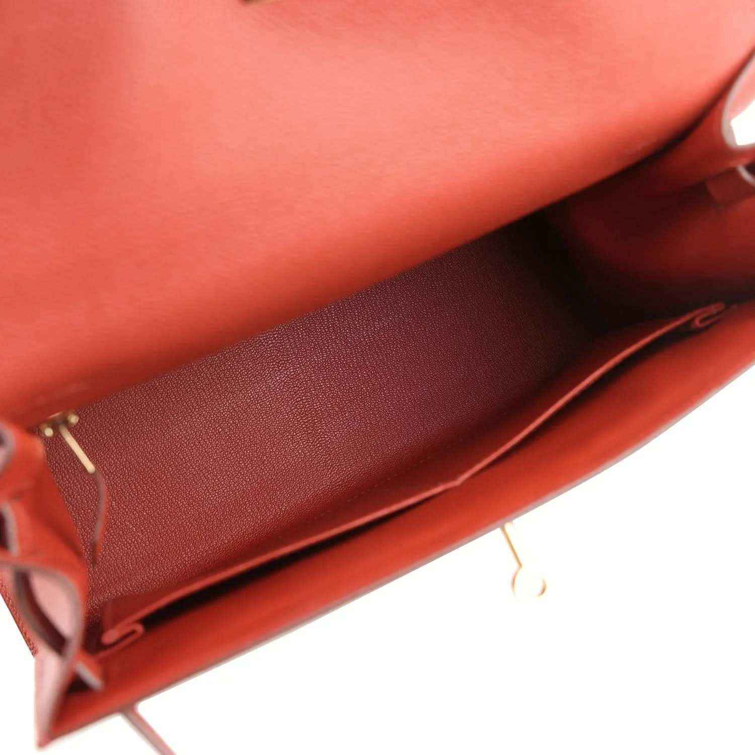 Red Kelly handbag interior with smooth lining and leather trim
