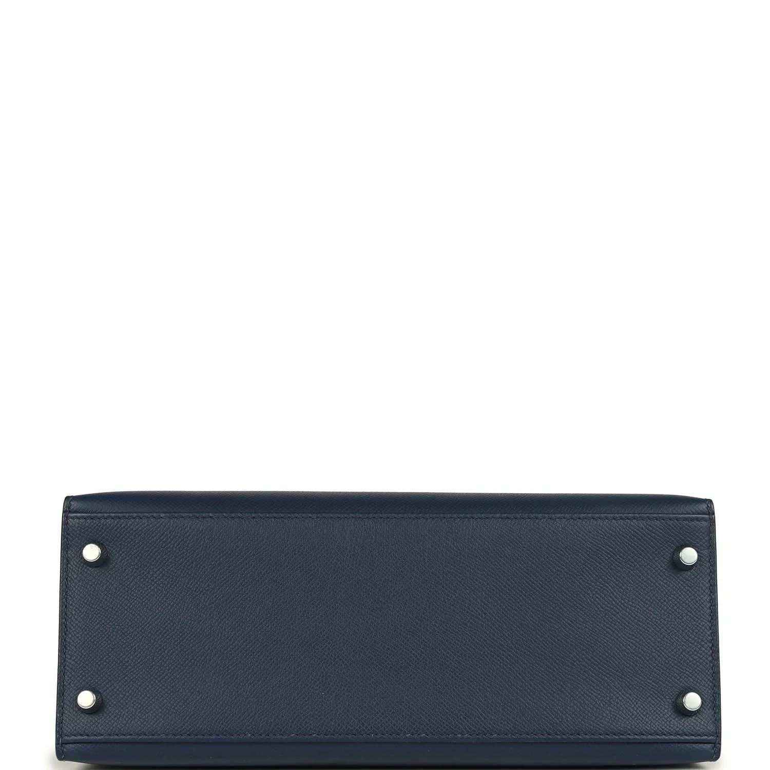 Hermes Kelly Sellier 28 handbag bottom view in dark blue pebbled leather with corner studs