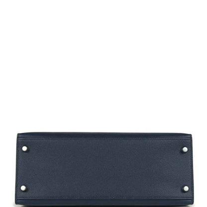Hermes Kelly Sellier 28 handbag bottom view in dark blue pebbled leather with corner studs
