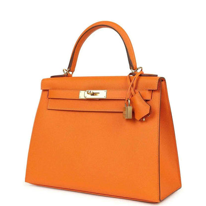 Orange Epsom leather Kelly handbag front view with lock, top handle, and gold hardware