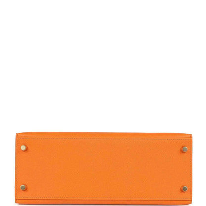 Orange Epsom leather handbag base panel with metal rivets