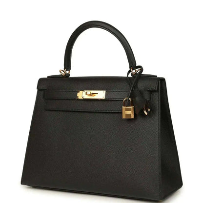 Black structured handbag with gold-tone front clasp and top handles
