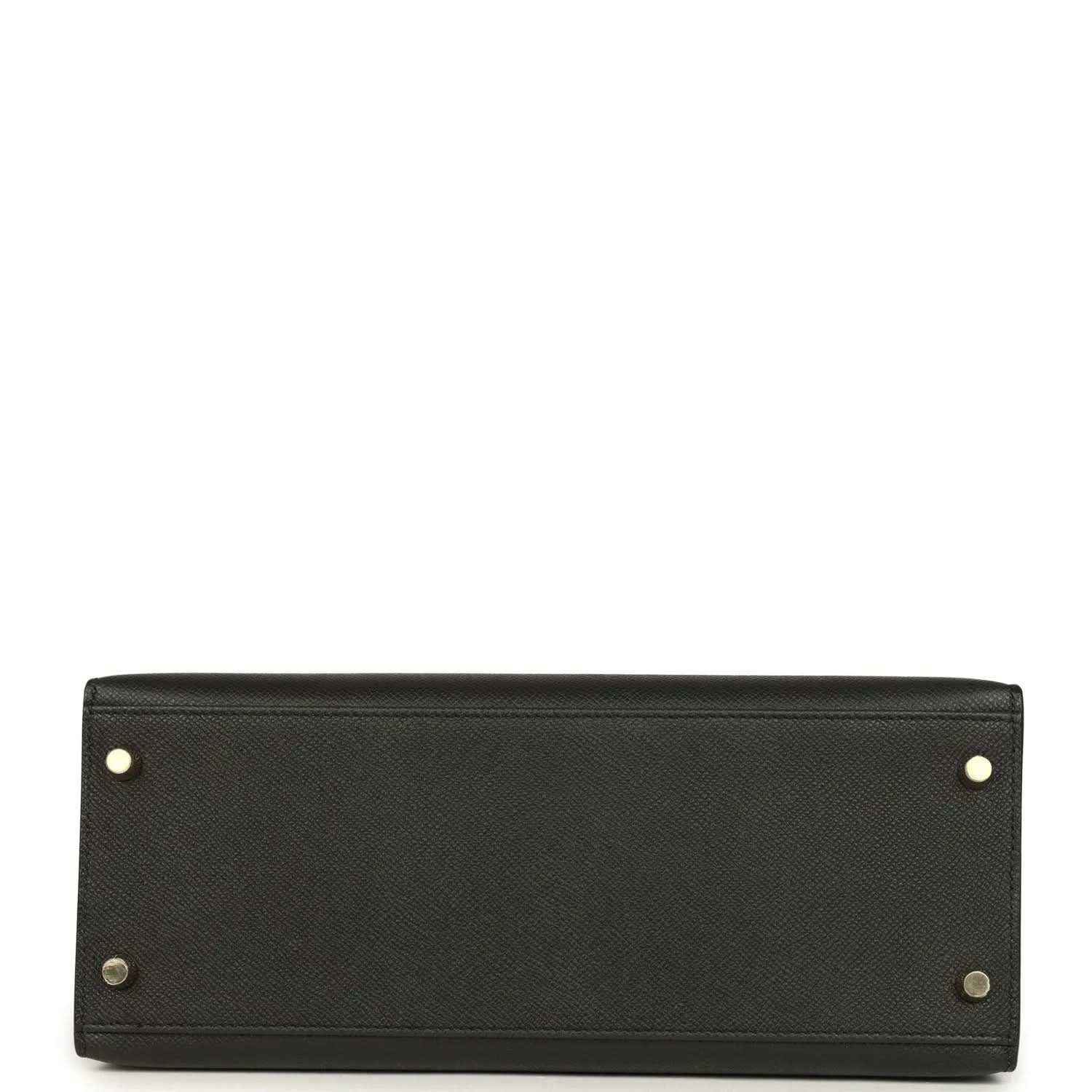 Black leather handbag base with gold-tone corner studs and button hardware