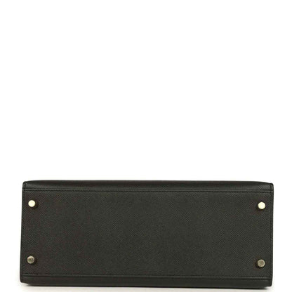 Black leather handbag base with gold-tone corner studs and button hardware