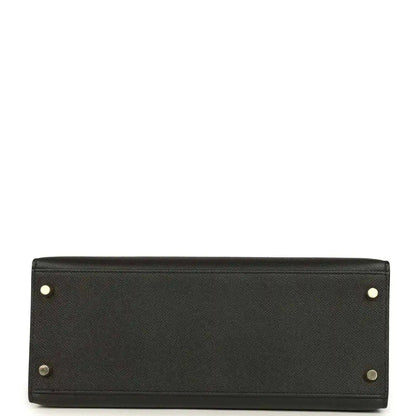 Black leather handbag base with gold-tone corner studs and button hardware