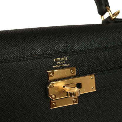 Hermes Kelly Sellier handbag lock plate and maker stamp on black leather