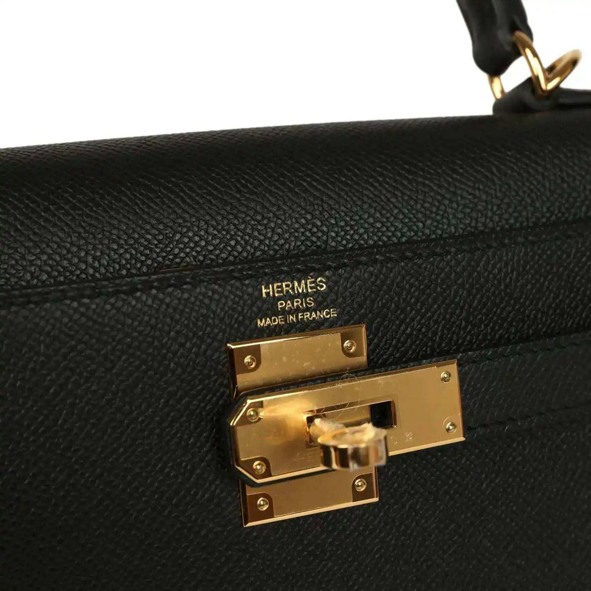 Hermes Kelly Sellier handbag lock plate and maker stamp on black leather