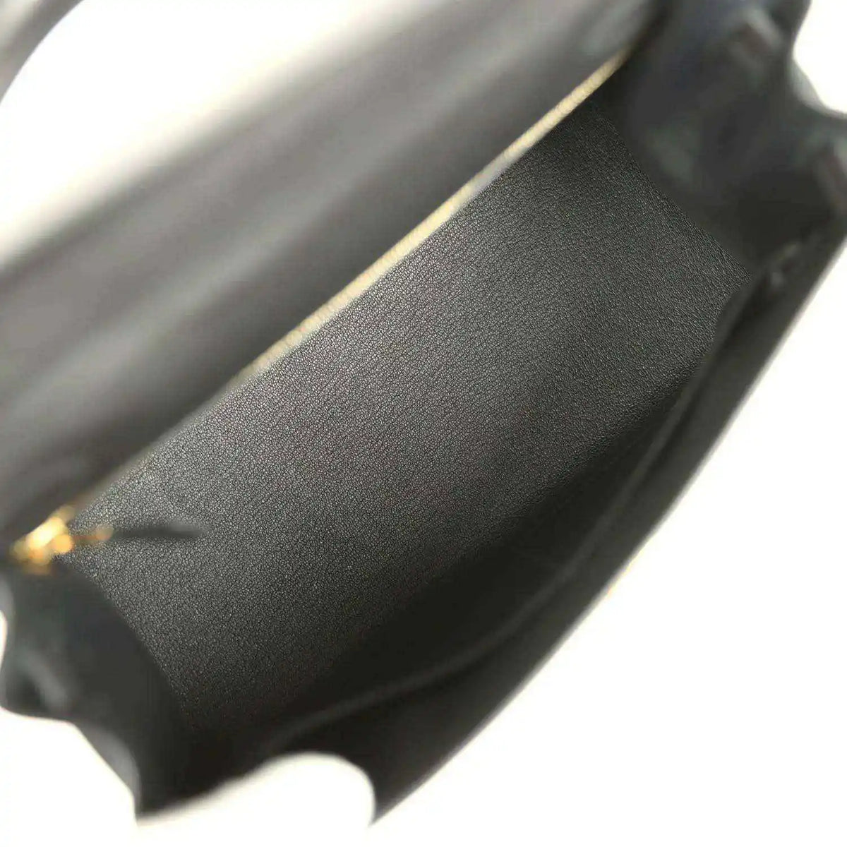 Black leather interior edge with gold-tone trim at the opening