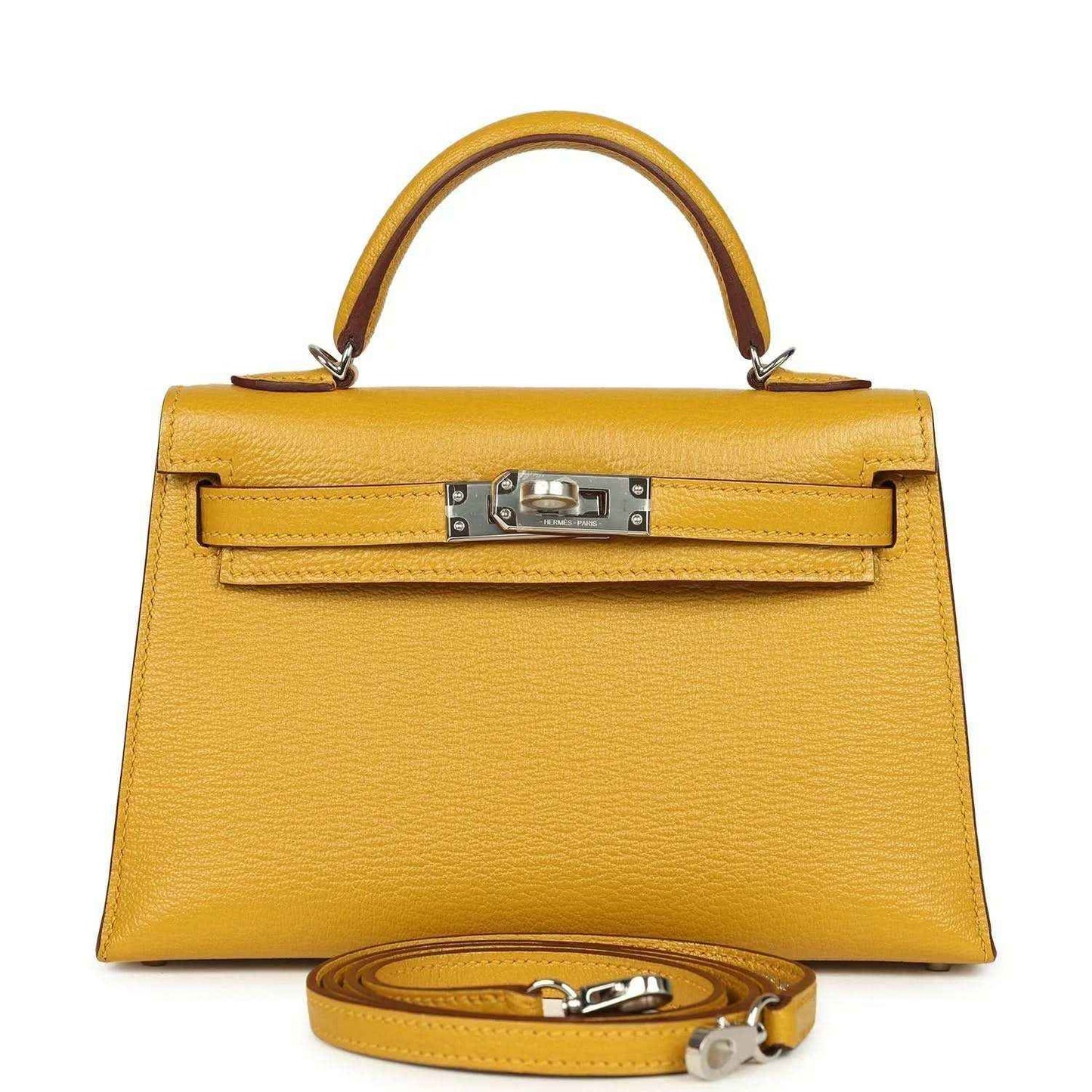 Yellow leather top-handle handbag with front clasp and attached shoulder strap, silver hardware