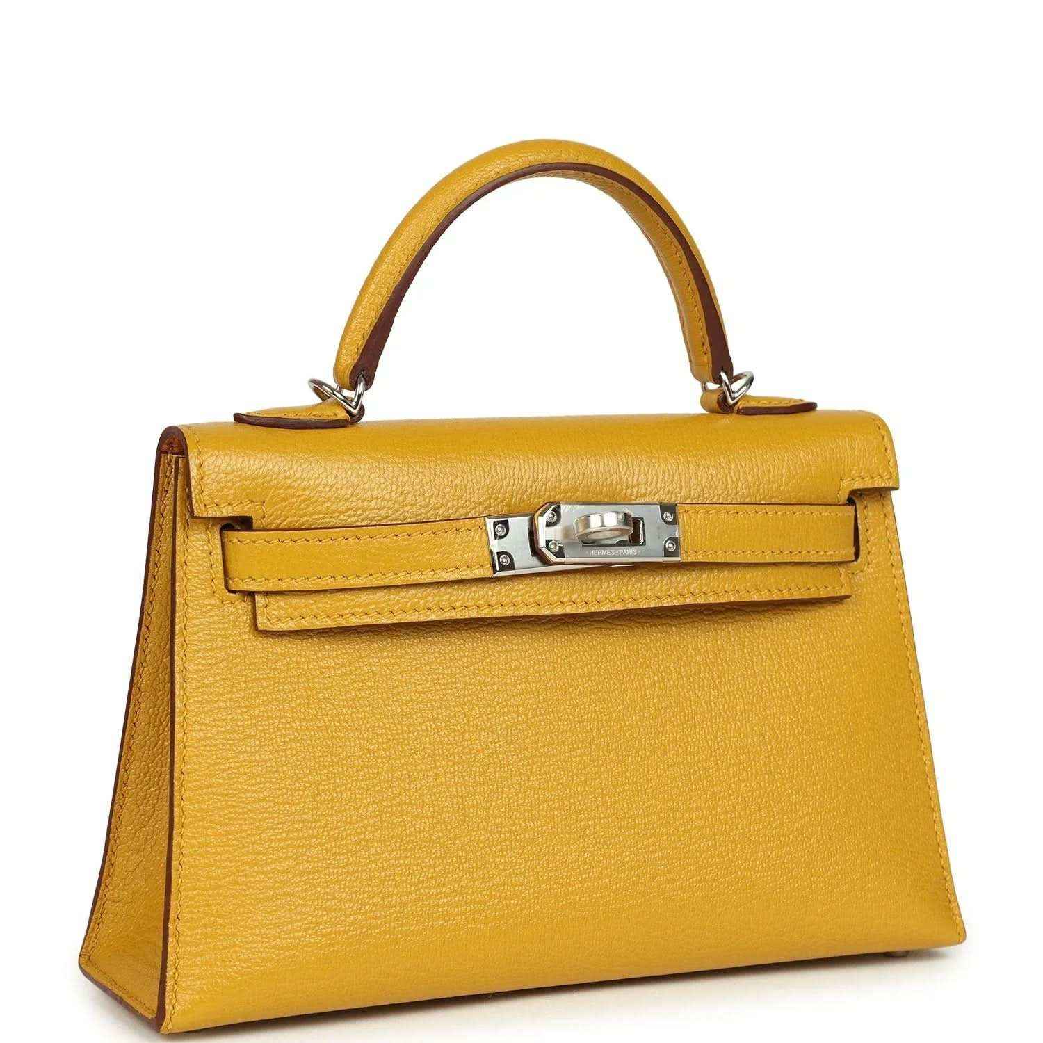 Yellow leather Kelly-style handbag with front lock clasp and top handles, silver-tone hardware