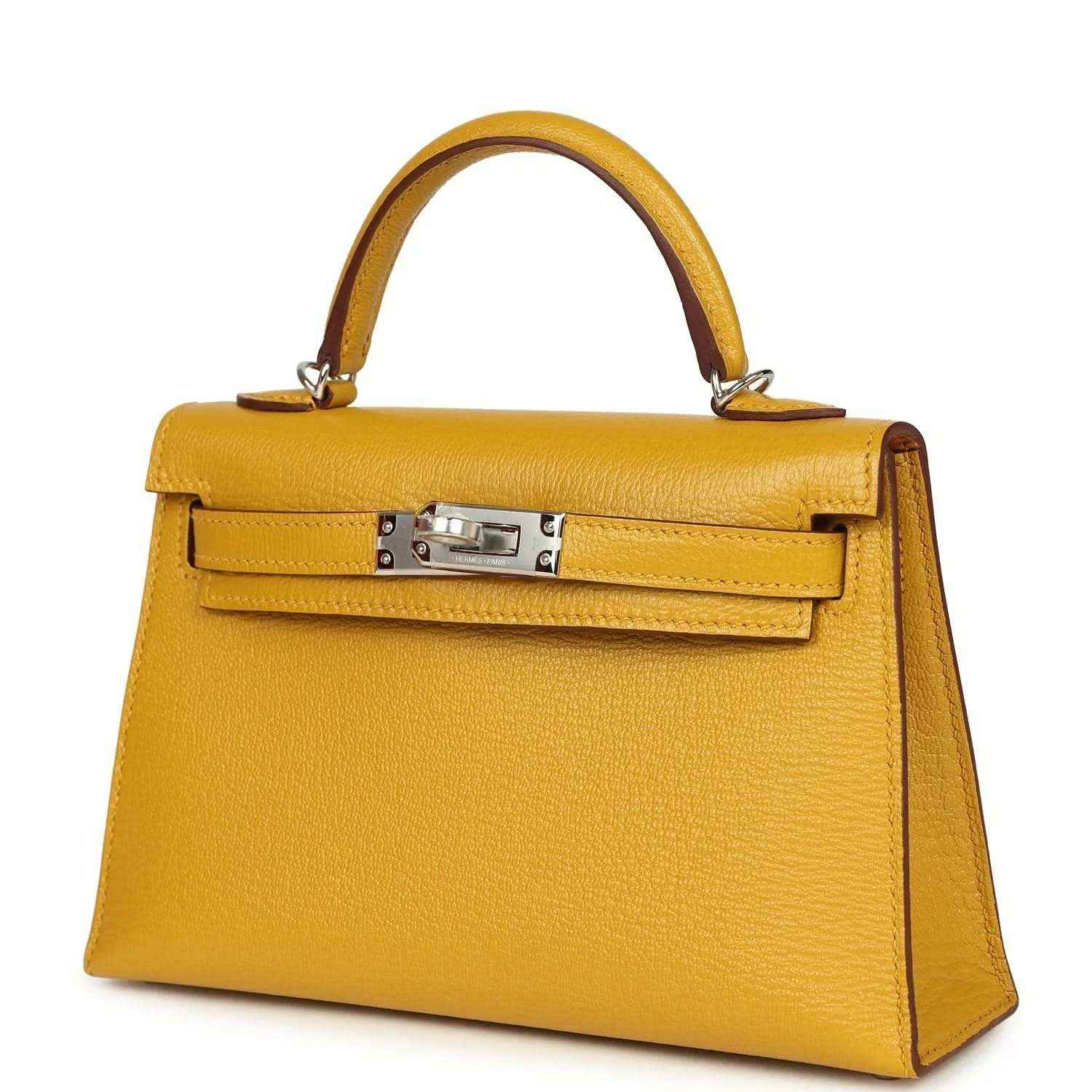 Yellow leather Kelly-style handbag with front flap clasp and top handles, silver hardware