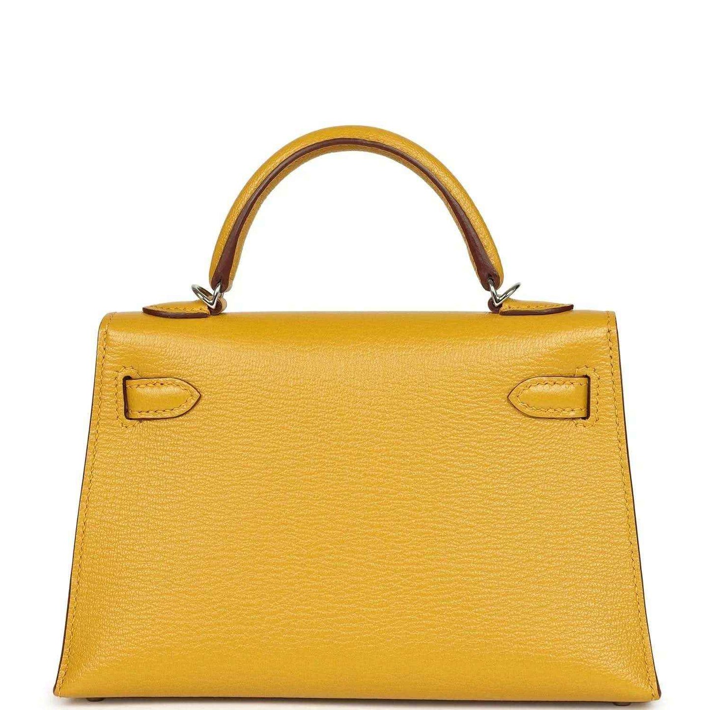 Yellow leather handbag front with curved top handles and symmetrical flap locks, silver-tone hardware