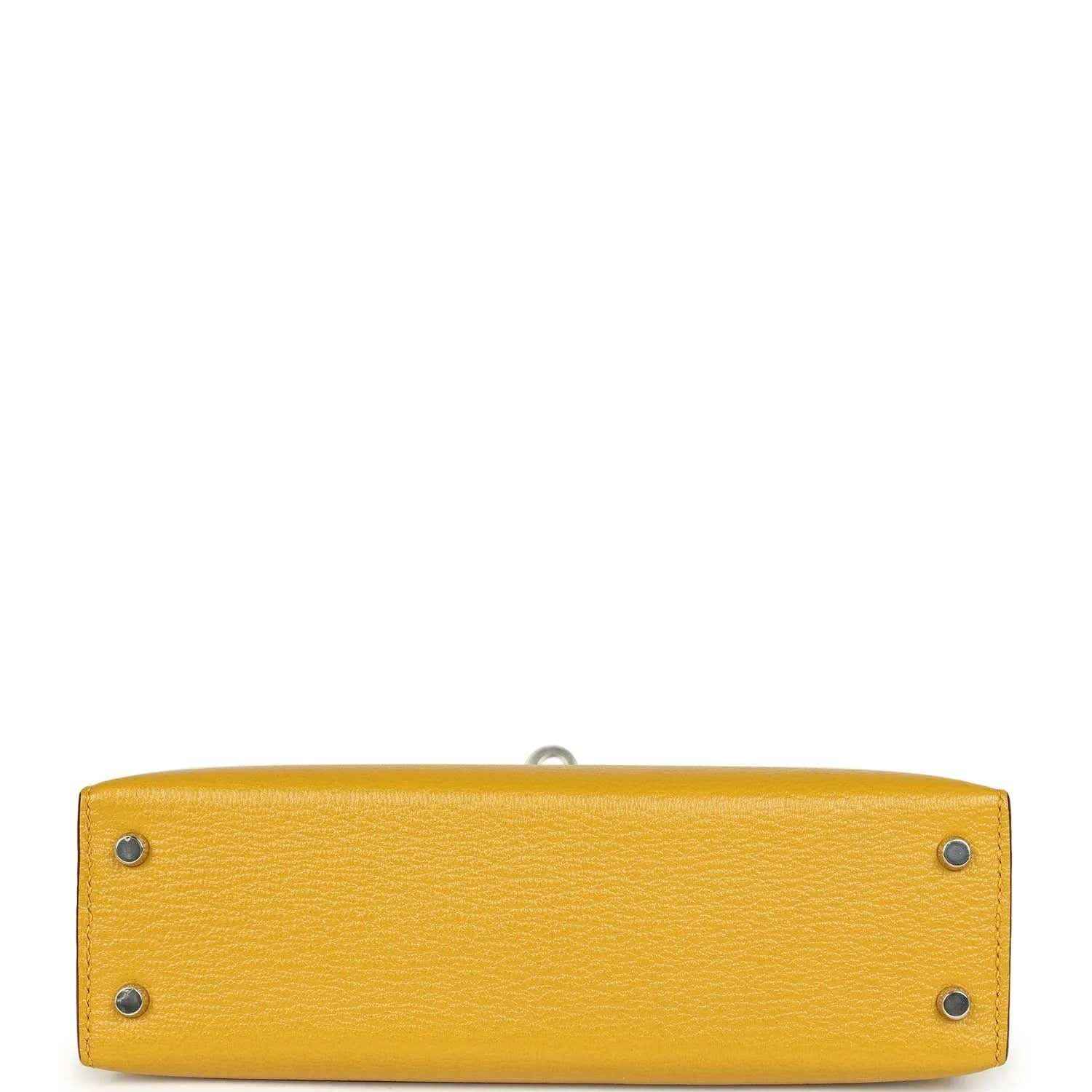 Yellow leather handbag base with two metal studs and inner seam, silver-tone hardware