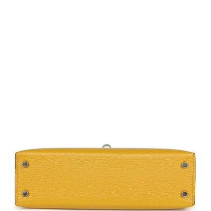 Yellow leather handbag base with two metal studs and inner seam, silver-tone hardware