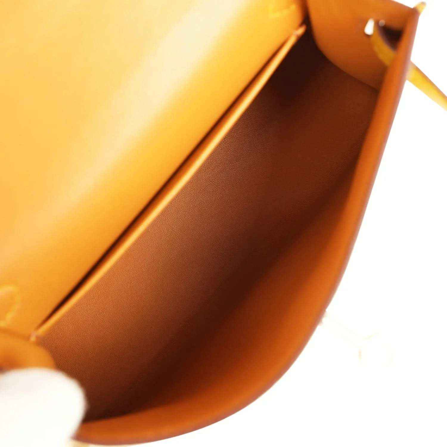 Yellow leather handbag interior view with curved lining and visible inner seam