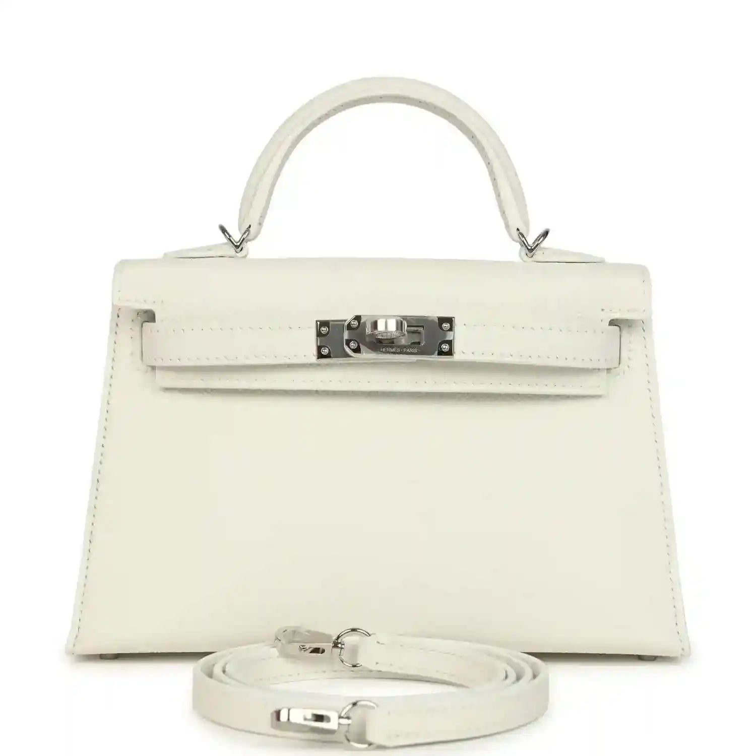 White mini Kelly-style handbag with top handle, front flap, metal clasp, and shoulder strap