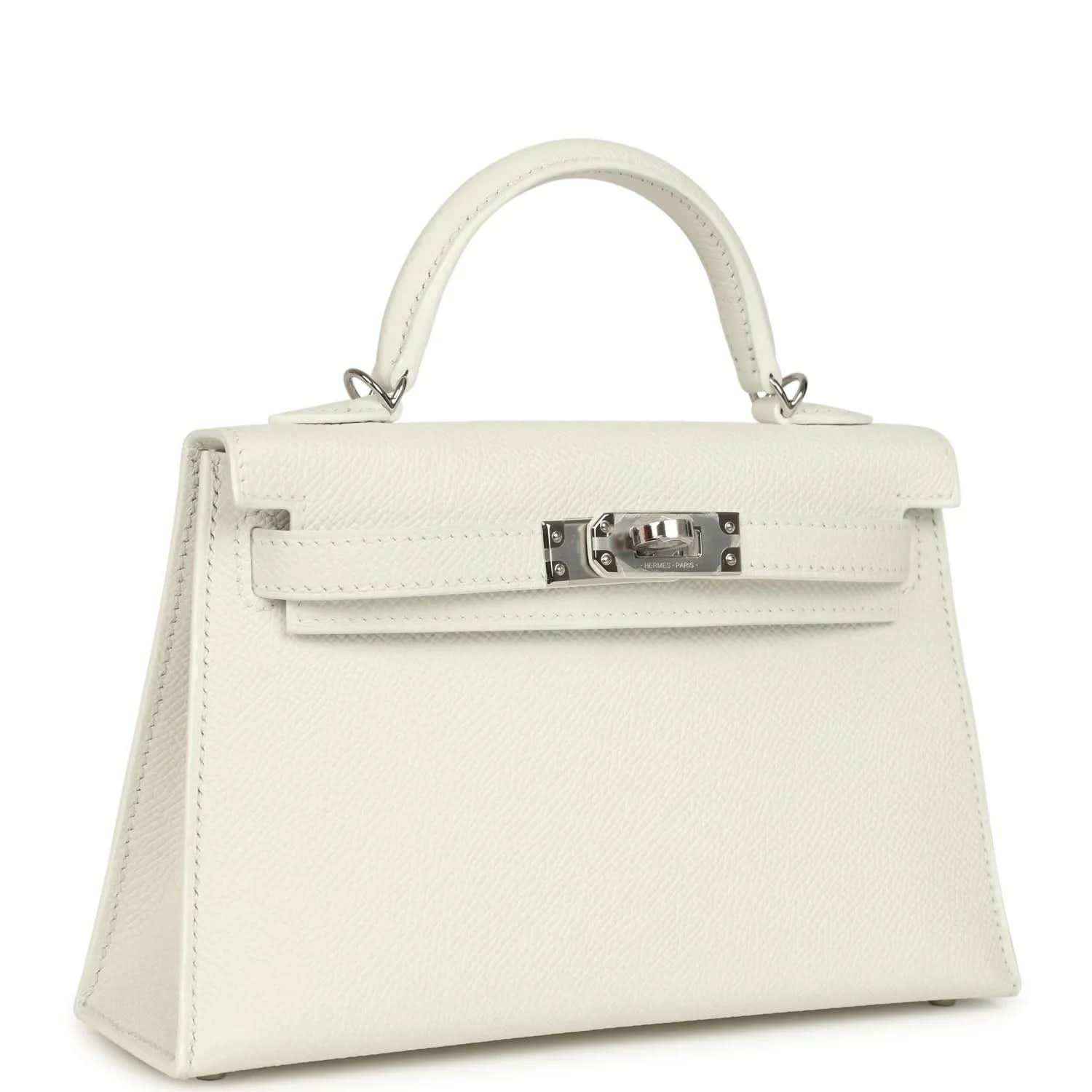 White mini Kelly-style handbag with top handles and front flap with metal clasp