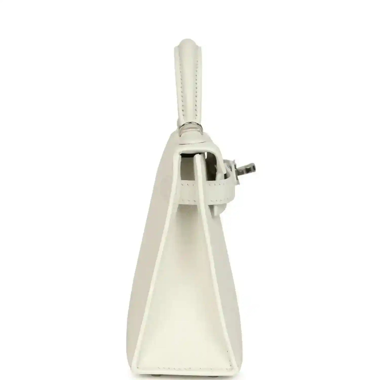 White mini Kelly-style handbag side view with handle strap and metal hardware attachment