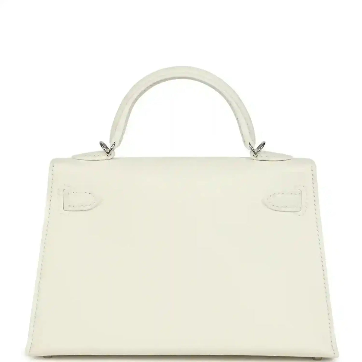White mini Kelly-style handbag back view with top handles and stitched panel details